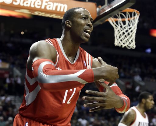 Houston Rockets forward Dwight Howard complains that he was fouled during the first half of an NBA basketball game against the Portland Trail Blazers in Portland, Ore., Tuesday, Nov. 5, 2013. (AP Photo/Don Ryan)